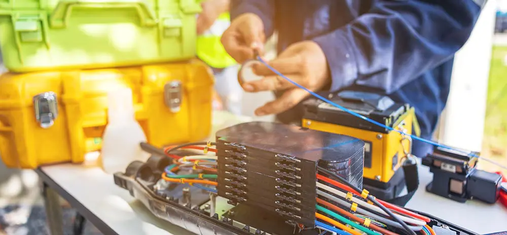 Man working on fiber optic cables