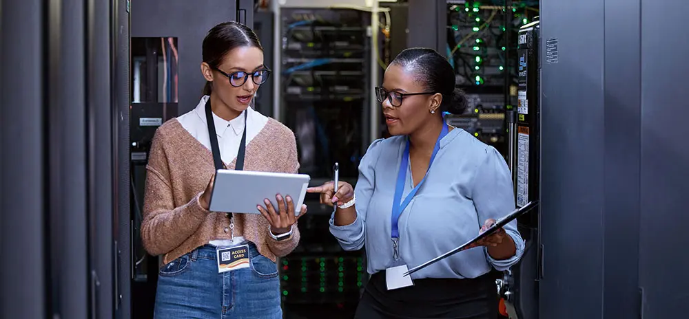 IIG team member offering guidance in a server room