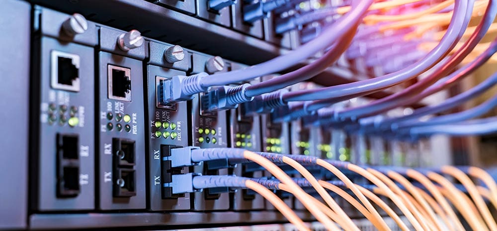 Fiber optic cables going into front panel switch ports