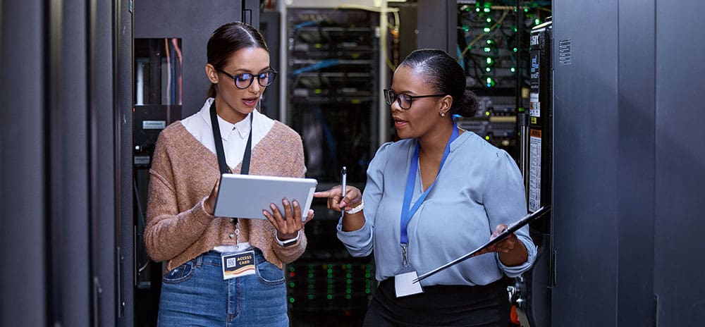 IIG team member offering guidance in a server room